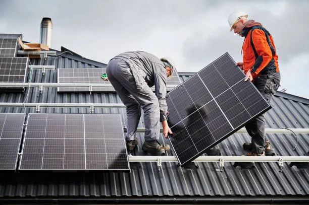 Homeowner reviewing a solar proposal with an installer